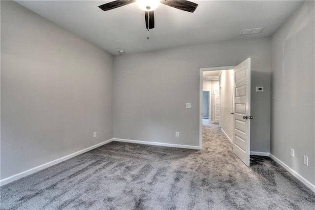 unfurnished room featuring carpet and ceiling fan