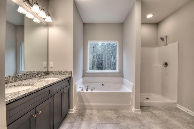 bathroom with tile patterned floors, plus walk in shower, and vanity