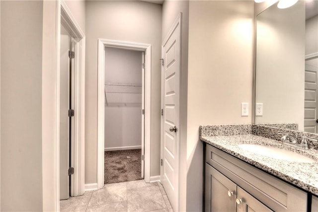 bathroom with tile patterned floors and vanity