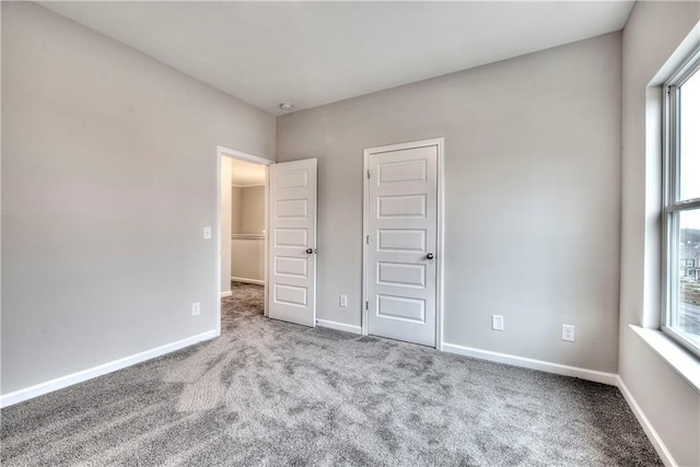 unfurnished bedroom with light carpet