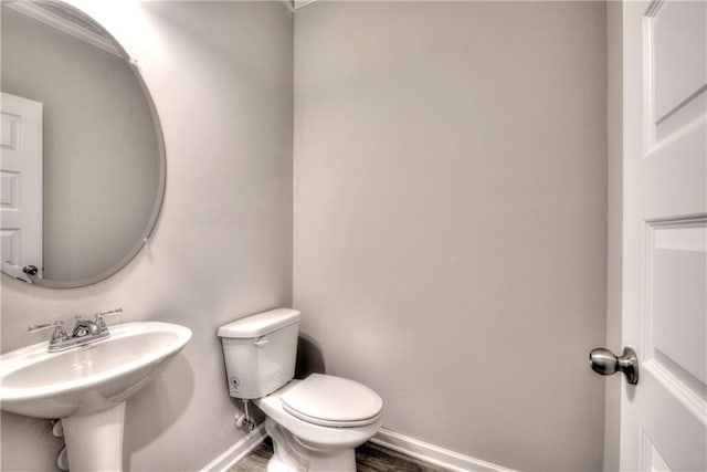 bathroom with sink and toilet