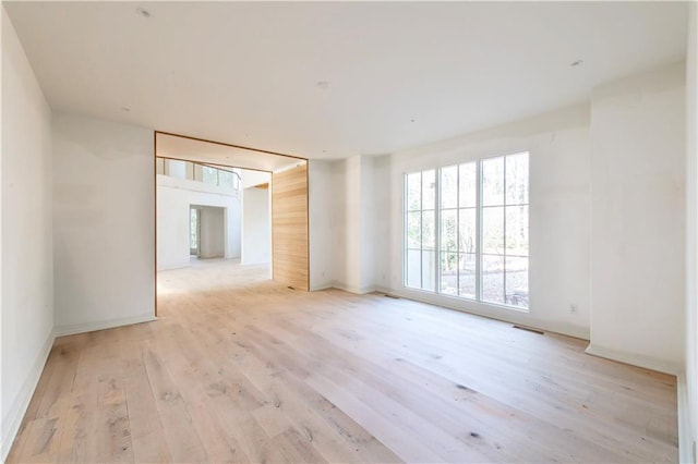 spare room with light wood-type flooring