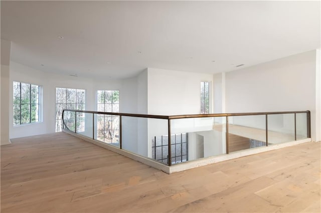 corridor featuring hardwood / wood-style floors