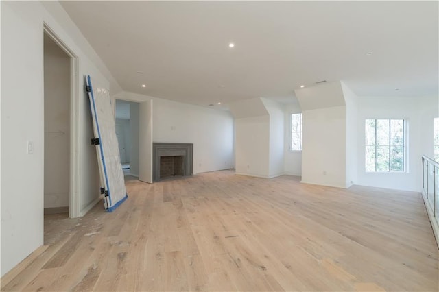 unfurnished living room with light hardwood / wood-style floors