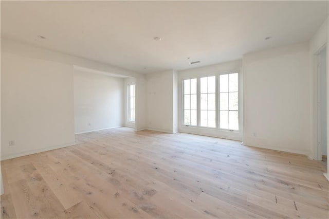 spare room with light hardwood / wood-style flooring