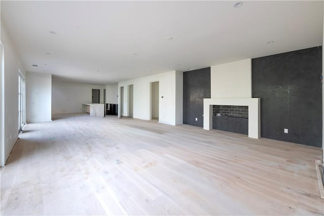 unfurnished living room with a fireplace