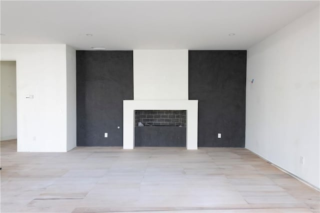 unfurnished living room featuring light tile patterned floors