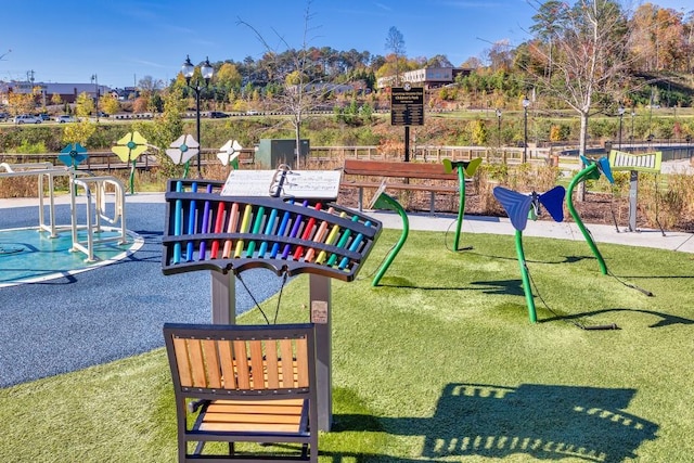 view of jungle gym featuring a lawn