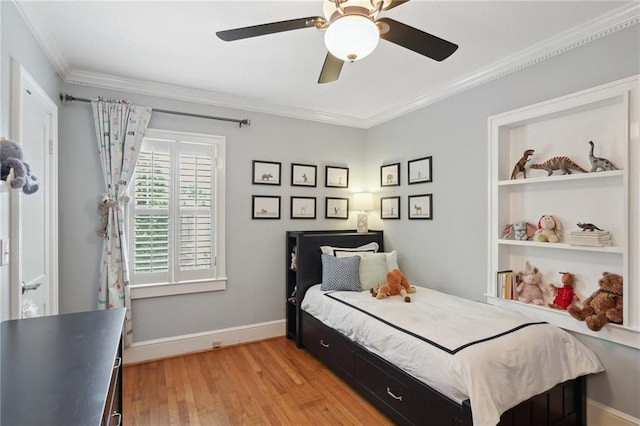 bedroom with light hardwood / wood-style flooring, ornamental molding, and ceiling fan