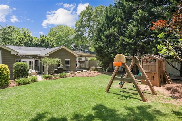 exterior space featuring a playground and a patio