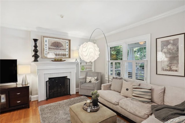 living room with ornamental molding and light wood-type flooring