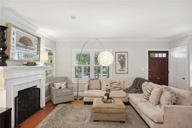 living room featuring hardwood / wood-style floors and crown molding