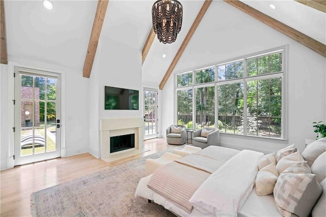 3146 Frontenac Ct NE, Atlanta, GA 30319 - bedroom with beamed ceiling, access to exterior, recessed lighting, wood finished floors, and a fireplace with flush hearth
