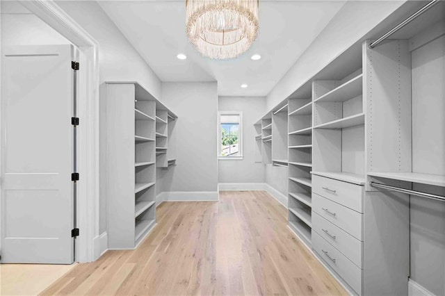3146 Frontenac Ct NE, Atlanta, GA 30319 - spacious closet with light wood finished floors and a chandelier