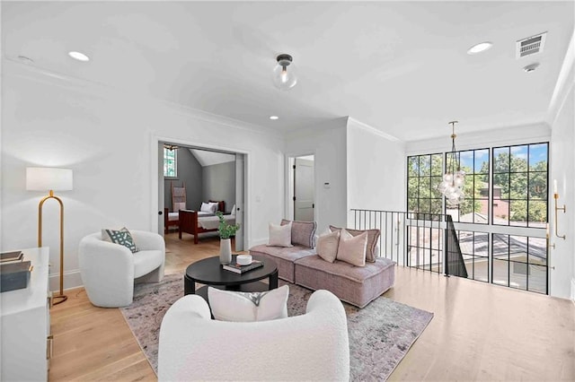 3146 Frontenac Ct NE, Atlanta, GA 30319 - living room featuring ornamental molding, baseboards, wood finished floors, recessed lighting, and a chandelier