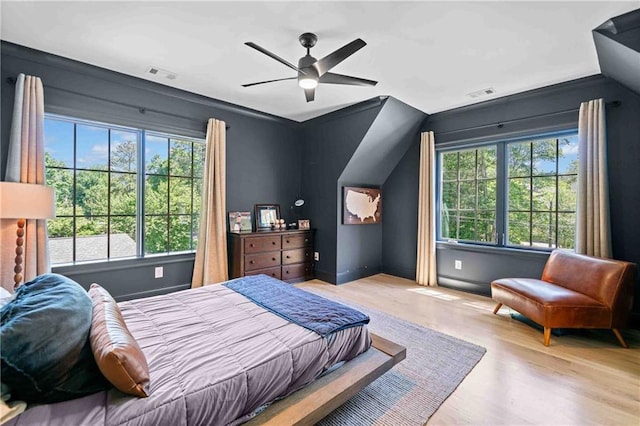 3146 Frontenac Ct NE, Atlanta, GA 30319 - bedroom featuring multiple windows, wood finished floors, vaulted ceiling, and ceiling fan