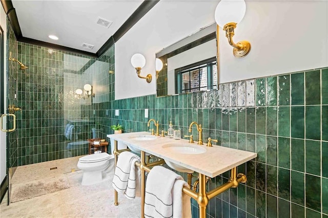 3146 Frontenac Ct NE, Atlanta, GA 30319 - full bathroom with tile walls, a shower stall, toilet, double vanity, and wainscoting