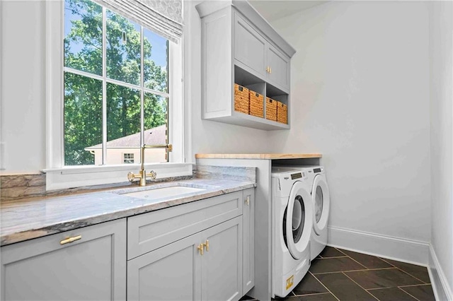 3146 Frontenac Ct NE, Atlanta, GA 30319 - laundry room with washer and dryer, cabinet space, baseboards, and dark tile patterned floors