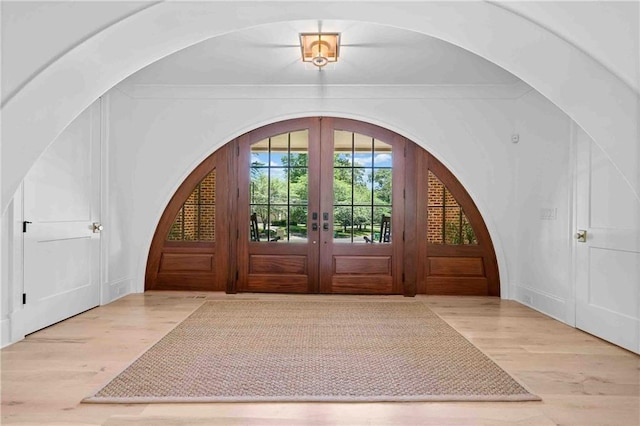 3146 Frontenac Ct NE, Atlanta, GA 30319 - entrance foyer featuring french doors, wood finished floors, and arched walkways