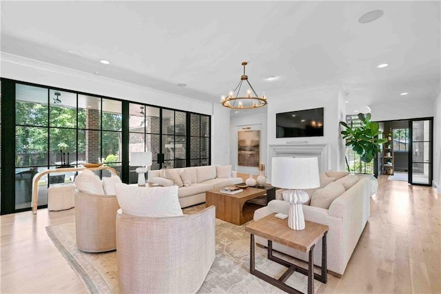 3146 Frontenac Ct NE, Atlanta, GA 30319 - living room featuring plenty of natural light, light wood-style floors, a chandelier, recessed lighting, and ornamental molding