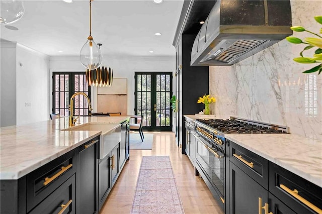 3146 Frontenac Ct NE, Atlanta, GA 30319 - kitchen with french doors, double oven range, island range hood, a sink, and light stone counters
