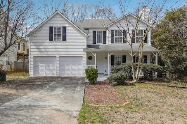 traditional-style home with a garage, a porch, driveway, and fence