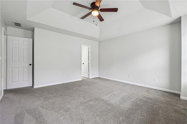 2205 Dresden Grn NW, Kennesaw, GA 30144 - carpeted empty room featuring baseboards, visible vents, ceiling fan, a textured ceiling, and a raised ceiling