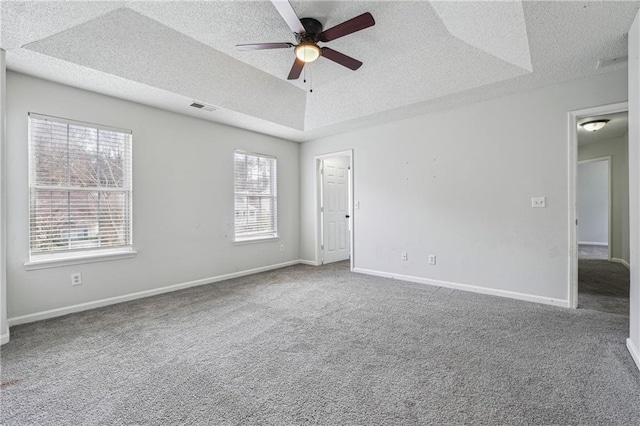 2205 Dresden Grn NW, Kennesaw, GA 30144 - unfurnished room with visible vents, baseboards, a tray ceiling, carpet flooring, and a textured ceiling