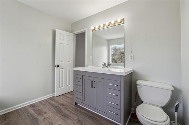 2205 Dresden Grn NW, Kennesaw, GA 30144 - bathroom with baseboards, toilet, wood finished floors, and vanity