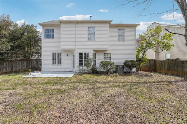 2205 Dresden Grn NW, Kennesaw, GA 30144 - rear view of house featuring a fenced backyard, central AC unit, a lawn, and a patio