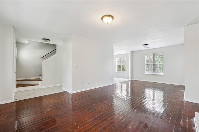2205 Dresden Grn NW, Kennesaw, GA 30144 - unfurnished living room featuring stairway, wood-type flooring, and baseboards