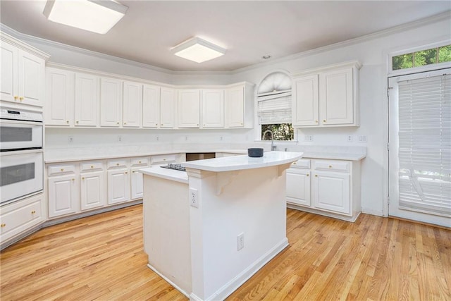 kitchen featuring white cabinets and a kitchen island