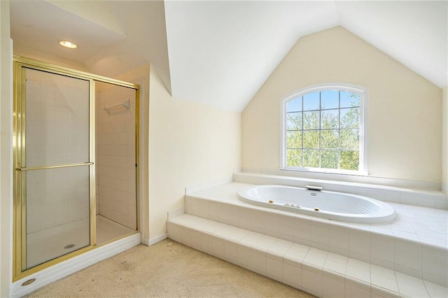 bathroom featuring shower with separate bathtub and vaulted ceiling