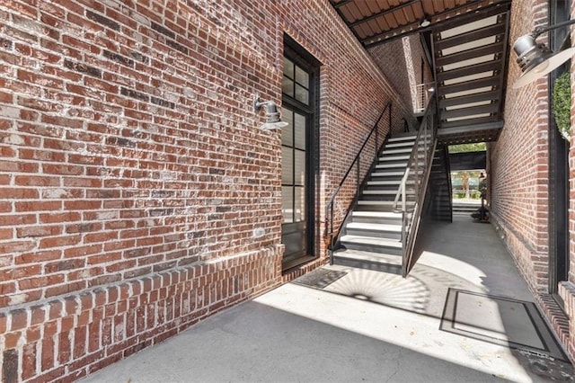 property entrance featuring brick siding