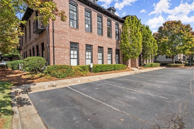 view of property with uncovered parking