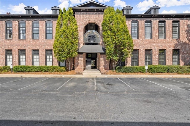 view of property featuring uncovered parking