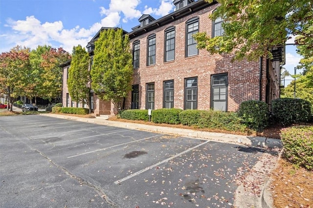 view of property with uncovered parking