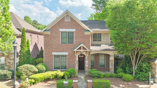 view of front of house featuring brick siding