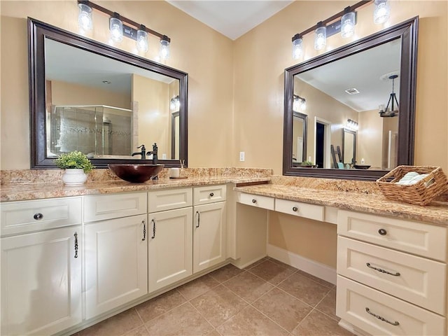 bathroom with vanity, tile patterned floors, a shower stall, and visible vents