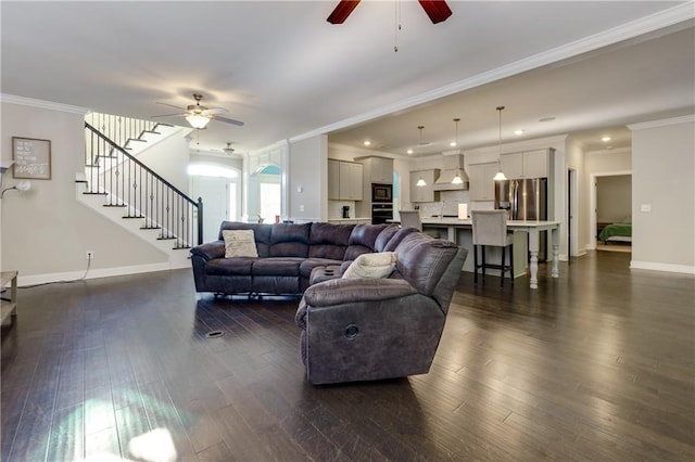 living room with crown molding, ceiling fan, and dark hardwood / wood-style floors