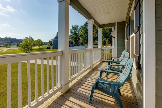 wooden terrace featuring a porch