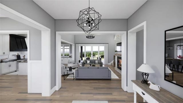 interior space featuring a notable chandelier and wood-type flooring