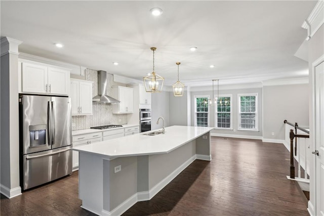 1036 Grant Park Rd, Decatur, GA 30033 - kitchen featuring stainless steel appliances, wall chimney range hood, a large island with sink, a sink, and backsplash
