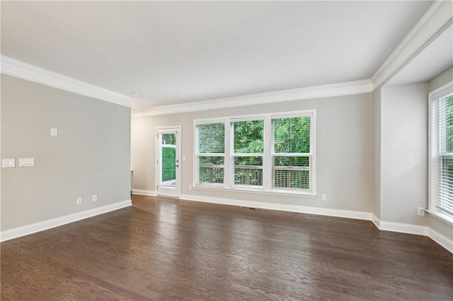 1036 Grant Park Rd, Decatur, GA 30033 - empty room featuring crown molding, plenty of natural light, dark wood-style flooring, and baseboards