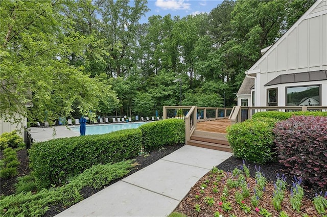 1036 Grant Park Rd, Decatur, GA 30033 - view of yard featuring a deck, a community pool, and view of wooded area