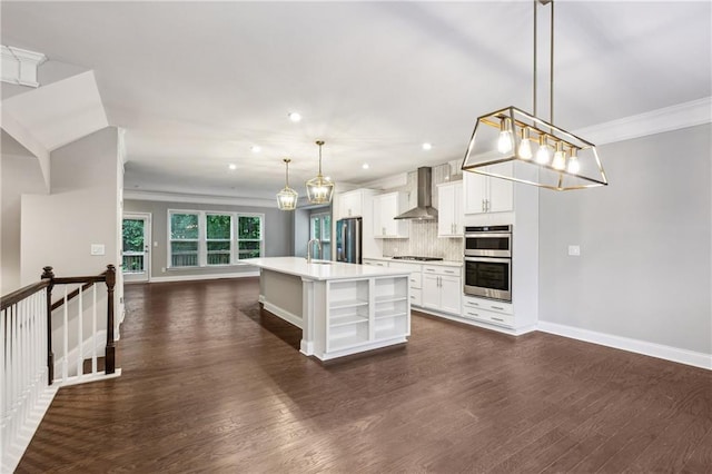 1036 Grant Park Rd, Decatur, GA 30033 - kitchen featuring wall chimney exhaust hood, appliances with stainless steel finishes, light countertops, backsplash, and dark wood-style flooring