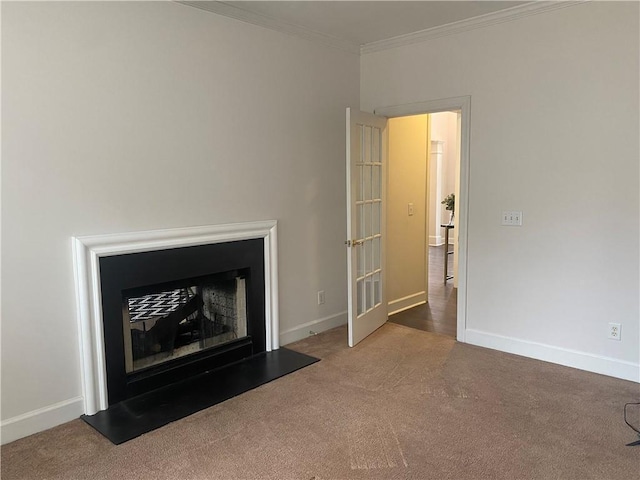 unfurnished living room featuring ornamental molding, carpet, and french doors