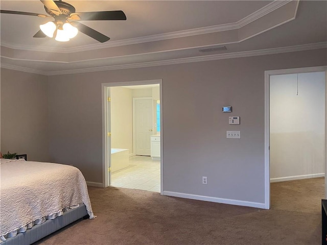 carpeted bedroom featuring ceiling fan, connected bathroom, a raised ceiling, and ornamental molding