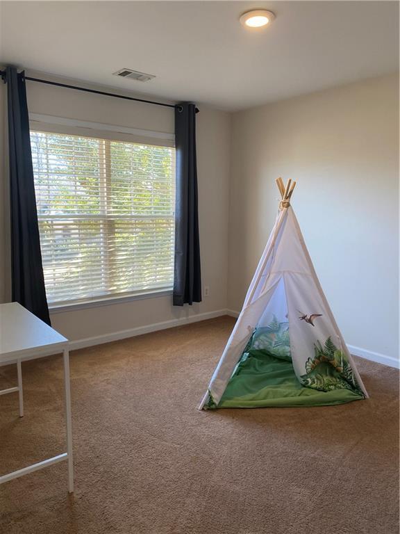 game room featuring carpet floors