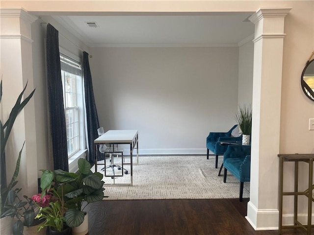 interior space with dark wood-type flooring, crown molding, and decorative columns